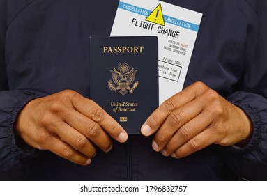 US Passport And Flight Cancellation Notice Held In Hand