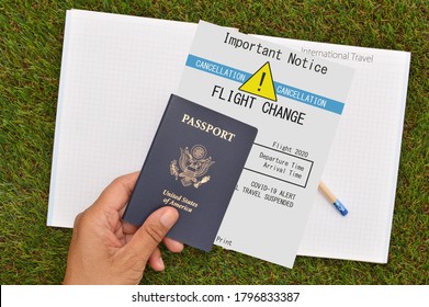 US Passport And Flight Cancellation Notice Held In Hand