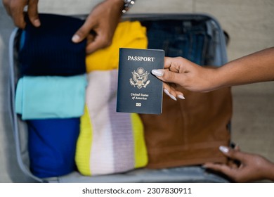 US Passport packing for trip carry on suitcase with clothes and american passports