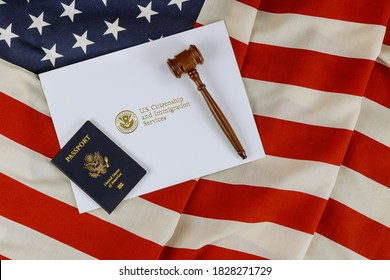 US Passports With Wooden Judge Gavel On American Flag On Legal World Immigration Concepts A Citizenship