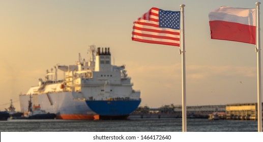 The US And Polish Flags And The American LNG Tanker During The Supply Of Liquefied Gas To The LNG Terminal In Świnoujście In Poland As Part Of A Multi-annual Agreement Between The USA And Poland