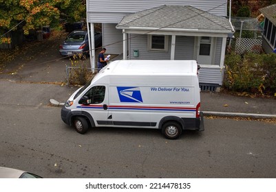 US Postman Mail Carrier Delivers To Neighborhood Home, Revere Massachusetts USA, October 12 2022