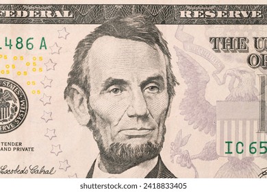 US President Abraham Abe Lincoln on USA five dollar bill macro, 5 usd