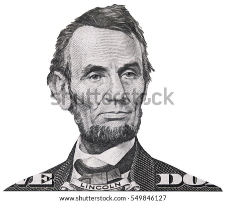 US President Abraham Abe Lincoln on USA five dollar bill macro isolated, 5 usd, United States of America money closeup