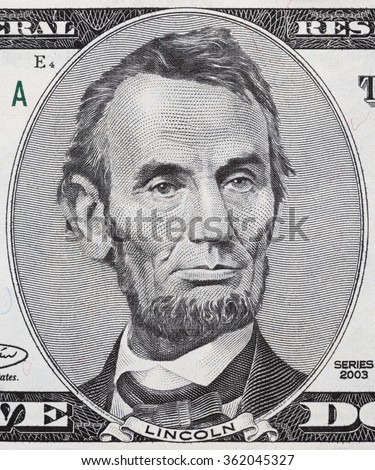 US President Abraham Lincoln face on five dollar bill macro, 5 usd, united states money closeup