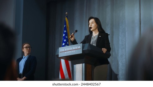 US presidential candidate comes to tribune and starts performance, answers journalists questions and gives interview to media. Female American republican politician at press conference. Elections day. - Powered by Shutterstock