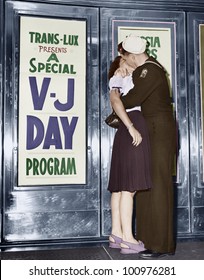 U.S. Sailor And His Girlfriend Celebrate News Of The End Of War With Japan In Front Of The Trans-Lux Theatre In New York's Time Square, August 14, 1945