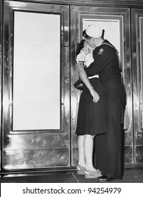 U.S. Sailor And His Girlfriend Celebrate News Of The End Of War With Japan In Front Of The Trans-Lux Theatre In New York's Time Square, August 14, 1945