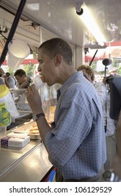 U.S. Senator Barak Obama Eating Corn Dog While Campaigning For President At Iowa State Fair In Des Moines Iowa, August 16, 2007