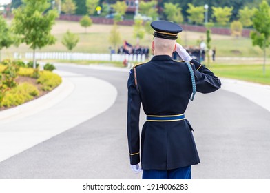 US Soldier Giving Salute At Military Burial Ceremony In Arlington National Cemetery In Washington DC, USA