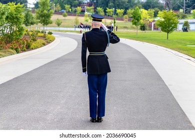 US Soldier Giving Salute At Military Burial Ceremony In Arlington National Cemetery In Washington DC, USA