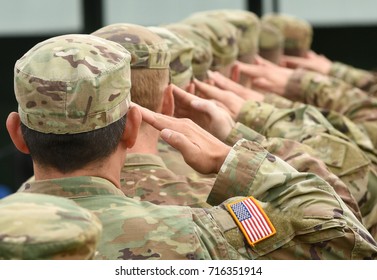 US soldiers giving salute  - Shutterstock ID 716351914