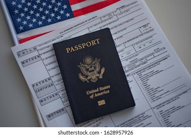 U.S. Standard Certificate Of Live Birth Application Form Next To American Flag And Passport Of USA.  Birthright Citizenship Concept. 