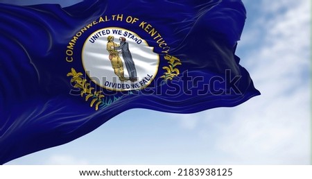 The US state flag of Kentucky waving in the wind. Kentucky is a state in the Southeastern region of the United States. Democracy and independence.