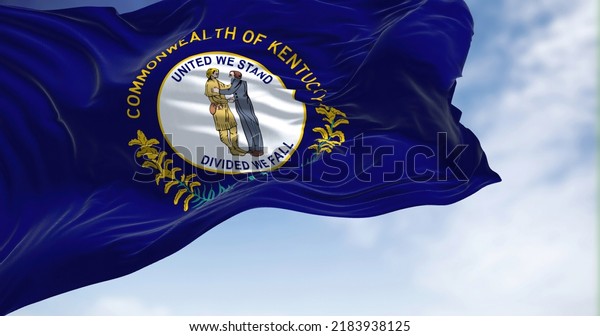 The US state flag of Kentucky waving in the\
wind. Kentucky is a state in the Southeastern region of the United\
States. Democracy and\
independence.