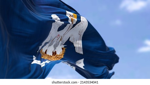 The US State Flag Of Louisiana Waving In The Wind. Louisiana Is A State In The Deep South And South Central Regions Of The United States. Democracy And Independence.