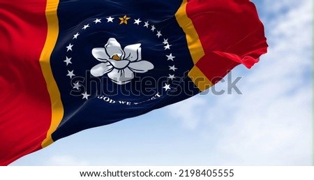 The US state flag of Mississippi waving in the wind. Mississippi is a state in the Southeastern region of the United States. Democracy and independence.