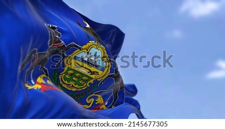 The US state flag of Pennsylvania waving in the wind. Pennsylvania is a U.S. state spanning the Mid-Atlantic, Northeastern, and Appalachian regions of the United States. Democracy and independence.