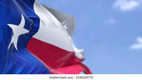 The US State Flag Of Texas Waving In The Wind. Texas Is A State In The South Central Region Of The United States. Democracy And Independence.