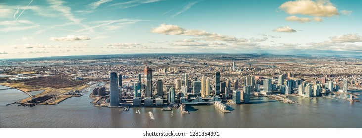 U.S. state of New Jersey, 01.January 2019, Skyline of Jersey City,  Hudson River and Newark in the background  - aerial panoramic view 