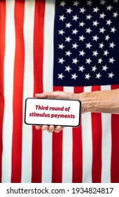 US Third Round Stimulus Payment Message On Mobile Phone With Flag Background