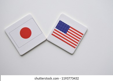 US (United States Of America) And Japan Flags Isolated On White Background.International Relation Ship Concept.  No People. Copy Space