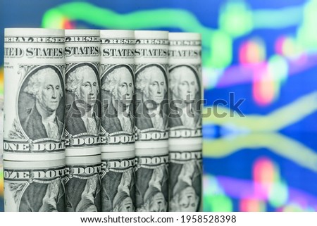 US USD one dollar banknotes with a technical analysis chart of financial instruments, depicts trading and speculating of foreign currencies. Investment in risky foreign exchange market for high profit