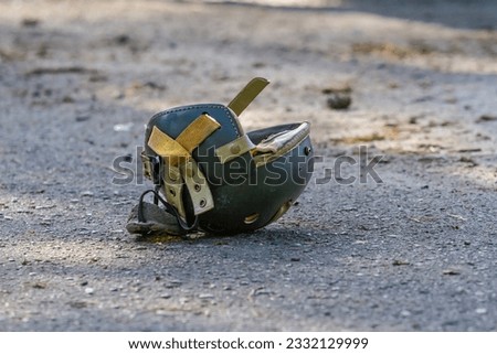 U.S. World War II tanker helmet lies on the ground