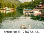 USA, Alaska, Tongass National Forest. Boat bow entering Elfin Cove.