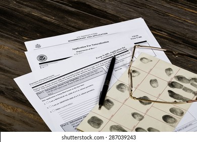 USA America Citizenship Application With Glasses. Public Documents And Studio Props.