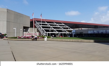 USA, Atlanta - August 20, 2014 - Georgia World Congress Center, Philips Arena, People Walking And Sitting Outside On A Sunny Day