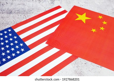 USA And China - Disagreement, US Of America And Chinese Flags. Relationship Conflict Between USA And China. Trade Deal, Closeup