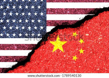USA and China flag print screen on wall crack.It is symbol of economic tariffs trade war and tax barrier between United States of America and China.