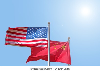 Usa And China National Flag Waving Against Blue Sky Side View Of Natural Color Of United States Of America Us And People Republic Of China State Symbols Isolated For Design Mockup Copy Space Template