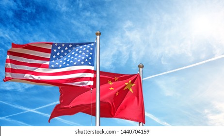 Usa And China National Flag Waving Against Clouds Blue Sky Wide Side View Of Natural Color Of United States Of America Us And People Republic Of China State Symbols Isolated Copy Space Concept