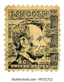 USA - CIRCA 1965: A Stamp Printed In USA Shows A Picture Of Abraham Lincoln Against A Log Cabin Wall In The Background, Circa 1965