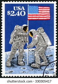 USA - CIRCA 1989: A Stamp Printed In USA Shows Raising Flag On Lunar Surface, July 20, 1969, Moon Landing, 20th Anniversary, Circa 1989