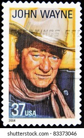 USA - CIRCA 2004: A stamp printed in United States of America shows famous american movies western actor John Wayne, circa 2004