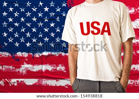 USA citizen in white shirt with USA print and American flag in background for 4th of July Stock photo © 