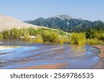 USA, Colorado. Great Sand Dunes National Park. Sangre De Cristo Mountains and Medano Creek.