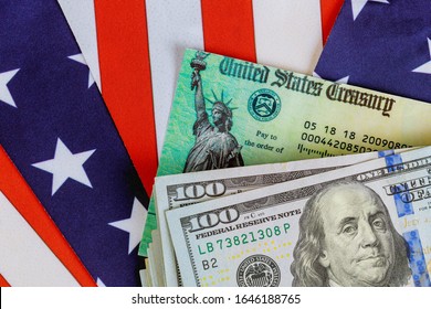 USA dollar cash banknote stimulus economic tax return check with US flag