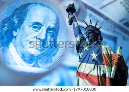 USA economy. Financial. Franklin's portrait next to statue of liberty. Statue of Liberty is painted in colors of the USA flag. Federal Reserve System of America. Concept - financial forecast for  USA