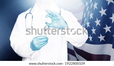 USA flag with doctor preparing for vaccine. Mass vaccination against the epidemic of coronavirus in USA  concept.