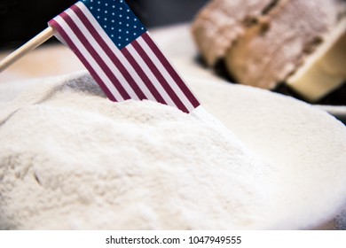 USA Flag In Flour, Slices Of Bread On The Background, Dark Tone. Financial Crisis, Poverty, Great Depression Concept