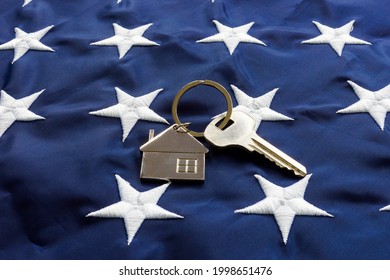 USA flag and key from home as symbol of VA loan.
