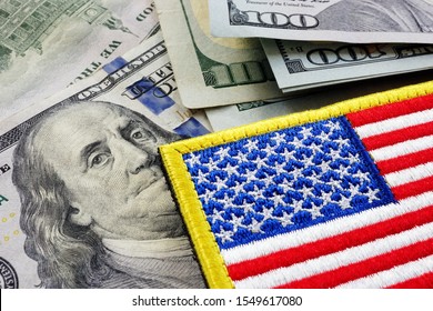 USA flag and money. Cash for VA loan from U.S. Department of Veterans Affairs.