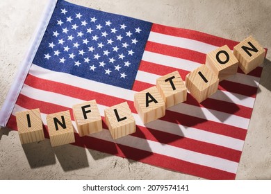 USA flag and wooden cubes with text, concept on the theme of inflation in America - Shutterstock ID 2079574141