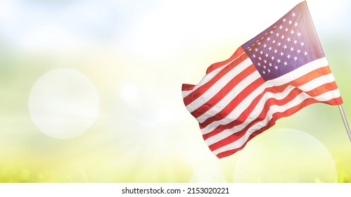 USA flags is waving on the sky - Shutterstock ID 2153020221