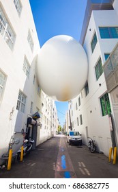 USA. FLORIDA. MIAMI BEACH. JULY, 2017: Art Installation On The South Beach. A Large White Ball Between The Houses Of Art Deco. Art Basel. 