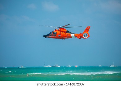 USA. FLORIDA. MIAMI BEACH. MAY 2019: US COAST GUARD AIR SEA RESCUE DEMONSTRATION. MH-65D Dolphin Helicopter. 